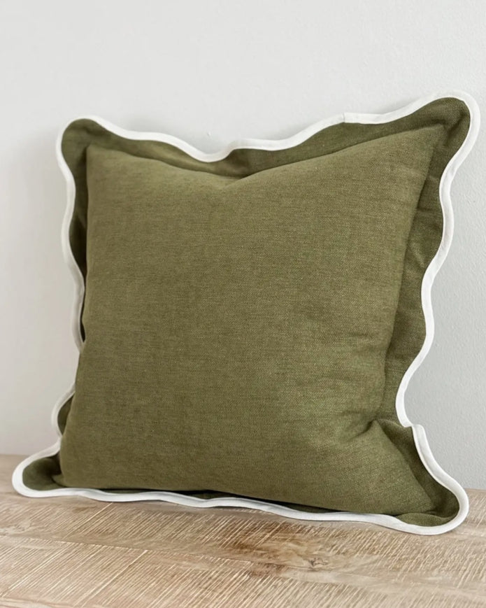 Olive green square cushion cover with scalloped edges, soft furnishings from Ellenvale Trade, showcasing intricate stitching and fabric texture.