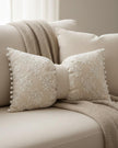 Cream neutral lace bow cushion from Starlight Express, soft furnishings with delicate lace detailing and plush fabric.