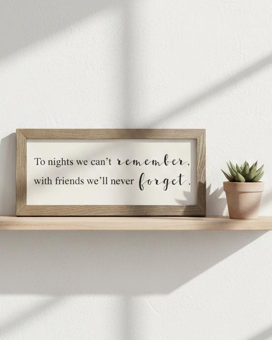 Rustic wooden framed wall art sign by Brayden and Brooks with the quote "To nights we can’t remember with friends we’ll never forget."