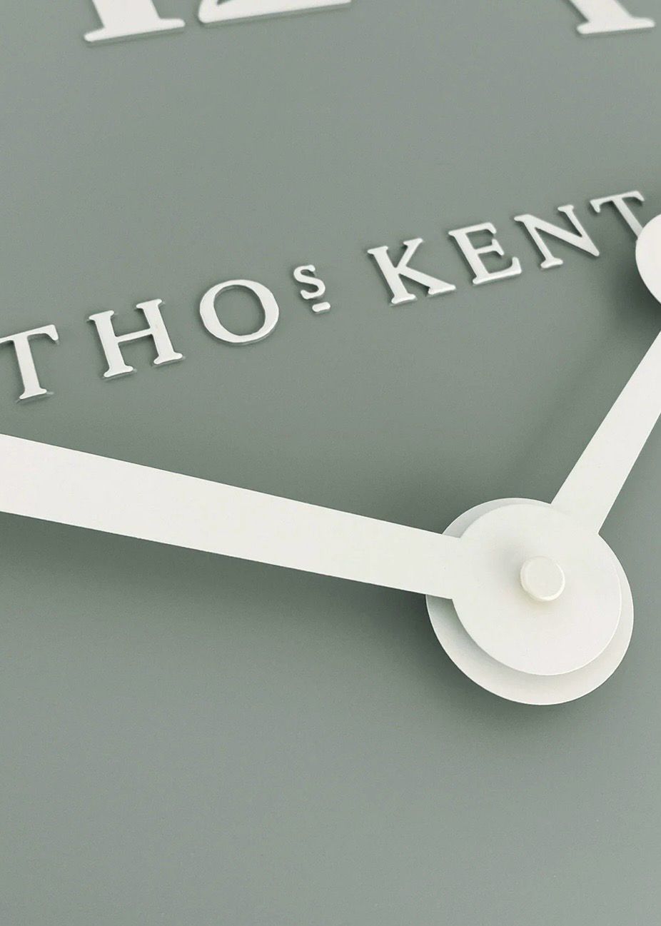 Thomas Kent 12-inch Arabic wall clock with seagrass green finish, featuring bold Arabic numerals and a stylish design.