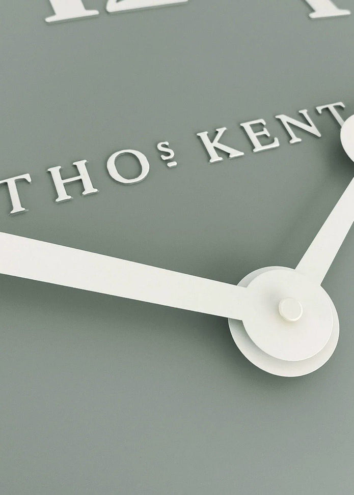 Thomas Kent 12-inch Arabic wall clock with seagrass green finish, featuring bold Arabic numerals and a stylish design.
