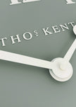 Thomas Kent 12-inch Arabic wall clock with seagrass green finish, featuring bold Arabic numerals and a stylish design.