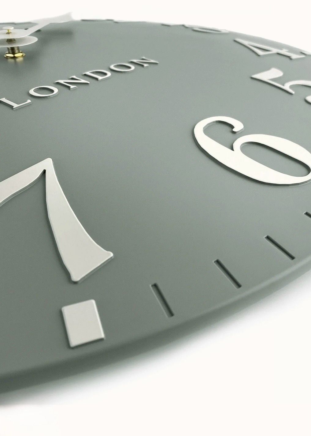 Thomas Kent 12-inch Arabic wall clock with seagrass green frame, stylish clock featuring bold Arabic numerals from Gallery Direct.