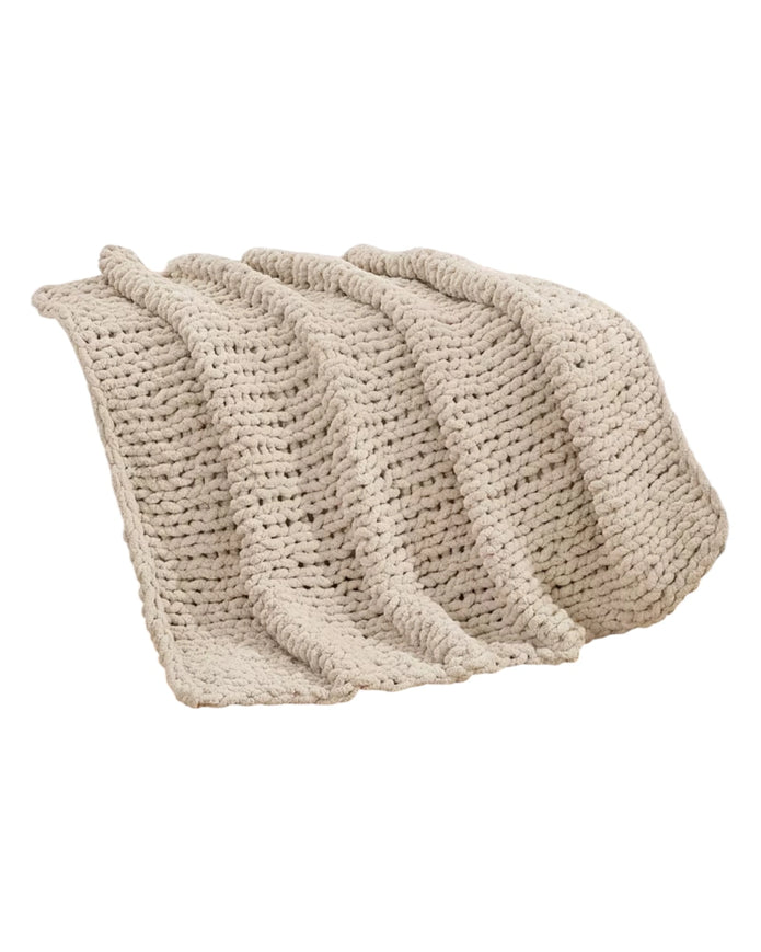 Cream chenille chunky knit blanket throw by Starlight Express, showcasing soft, cozy texture and plush knit design.