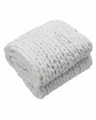 White chenille chunky knit blanket throw from Starlight Express, showcasing soft, cozy woven texture for home furnishings.