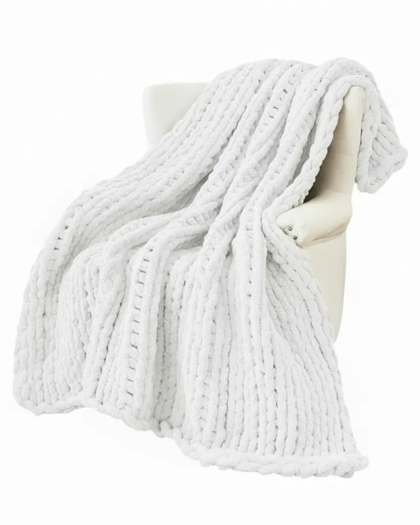 White chenille chunky knit blanket throw by Starlight Express, showing soft, cozy textured fabric and plush knit pattern.