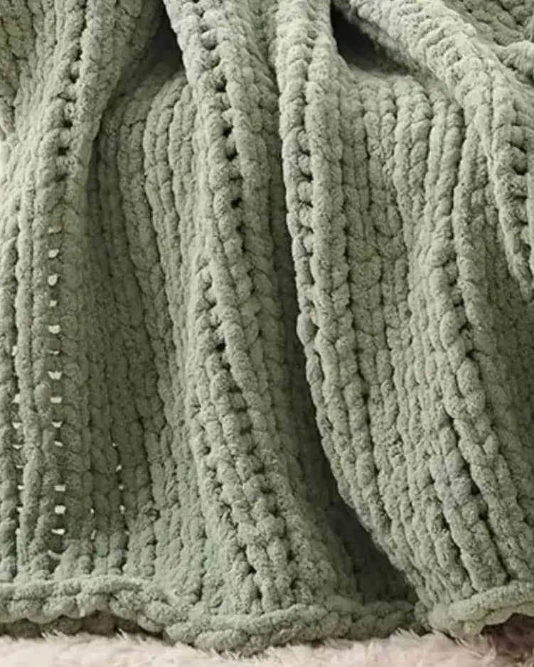 Sage green chunky chenille knit throw blanket from Starlight Express, soft and cozy for living room or bedroom decor.