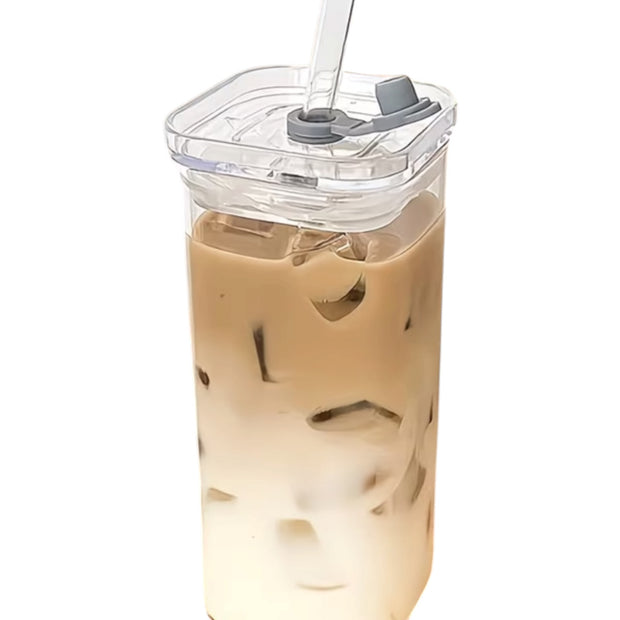 Square glass coffee cup with lid and straw by Starlight Express, featuring a clear glass design for hot or cold beverages.