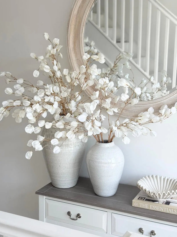Artificial white lantern stem from Lulu Loves Home, showcasing a delicate, dreamy white floral design for decorative use.