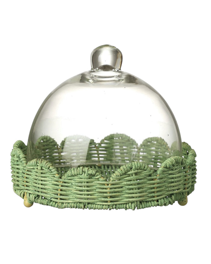 Glass cloche on footed green scalloped wicker base, decorative display cover for home decor by Heaven Sends.