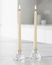 Cream Taper Dinner Candle by Lulu Loves Home displayed in a classic candle holder on a dining table.