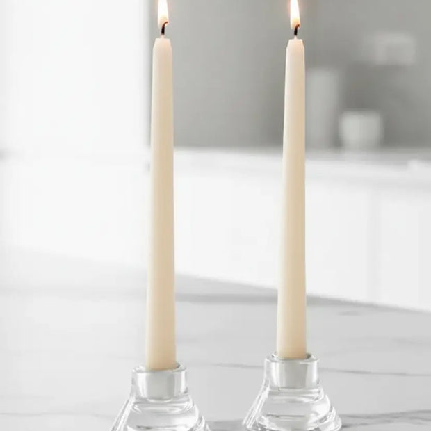 Cream Taper Dinner Candle by Lulu Loves Home displayed in a classic candle holder on a dining table.