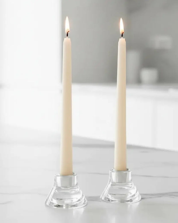 Cream Taper Dinner Candle by Lulu Loves Home displayed in a classic candle holder on a dining table.