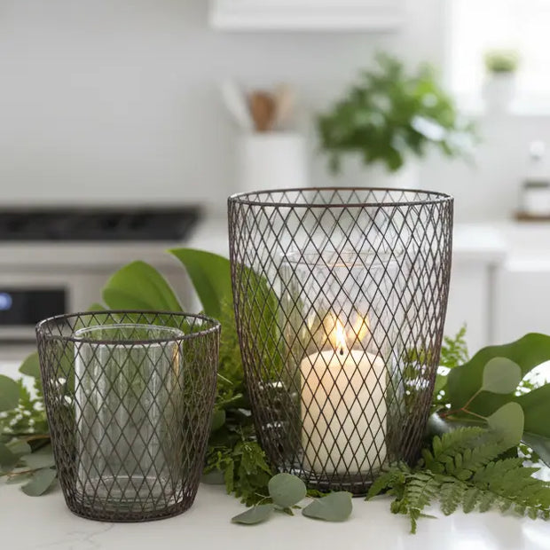 Set of two rust wire hurricane candle holders for home decor, featuring a rustic design with glass inserts by Terrace & Garden Ltd.