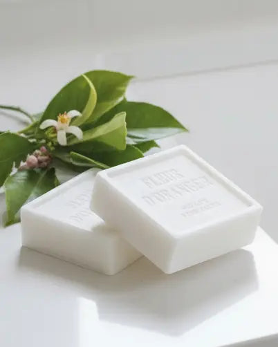 Rustic soap block with fleur d’oranger scent, used as a home fragrance by Terrace & Garden Ltd, shown in a natural setting.