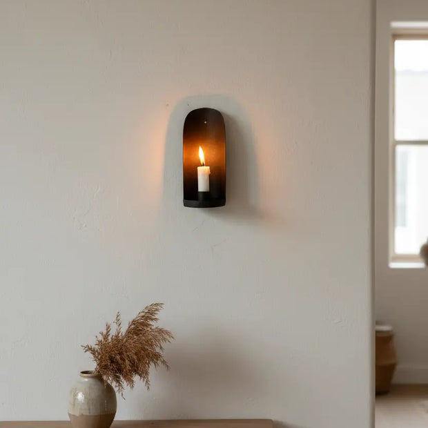 Rustic wall-mounted candle holder from Terrace & Garden Ltd, made of metal, suitable for home decor with a vintage finish.