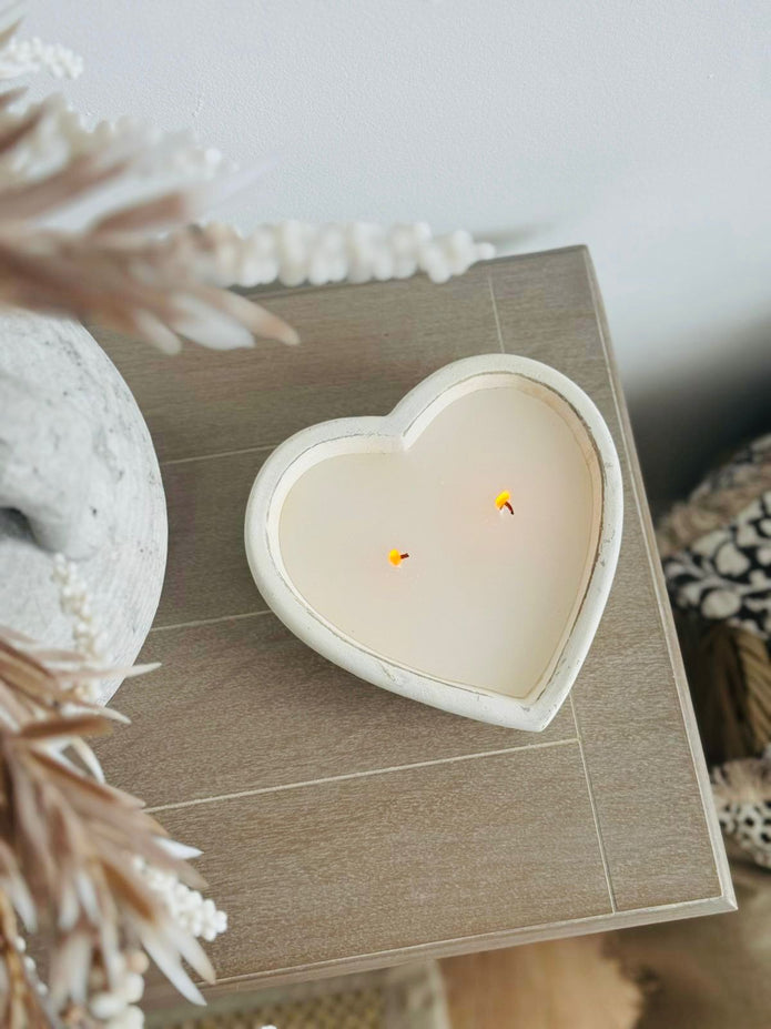 Rustic stone heart candle from Candlelight Products Ltd, showing a natural stone heart-shaped candle on a wooden surface.