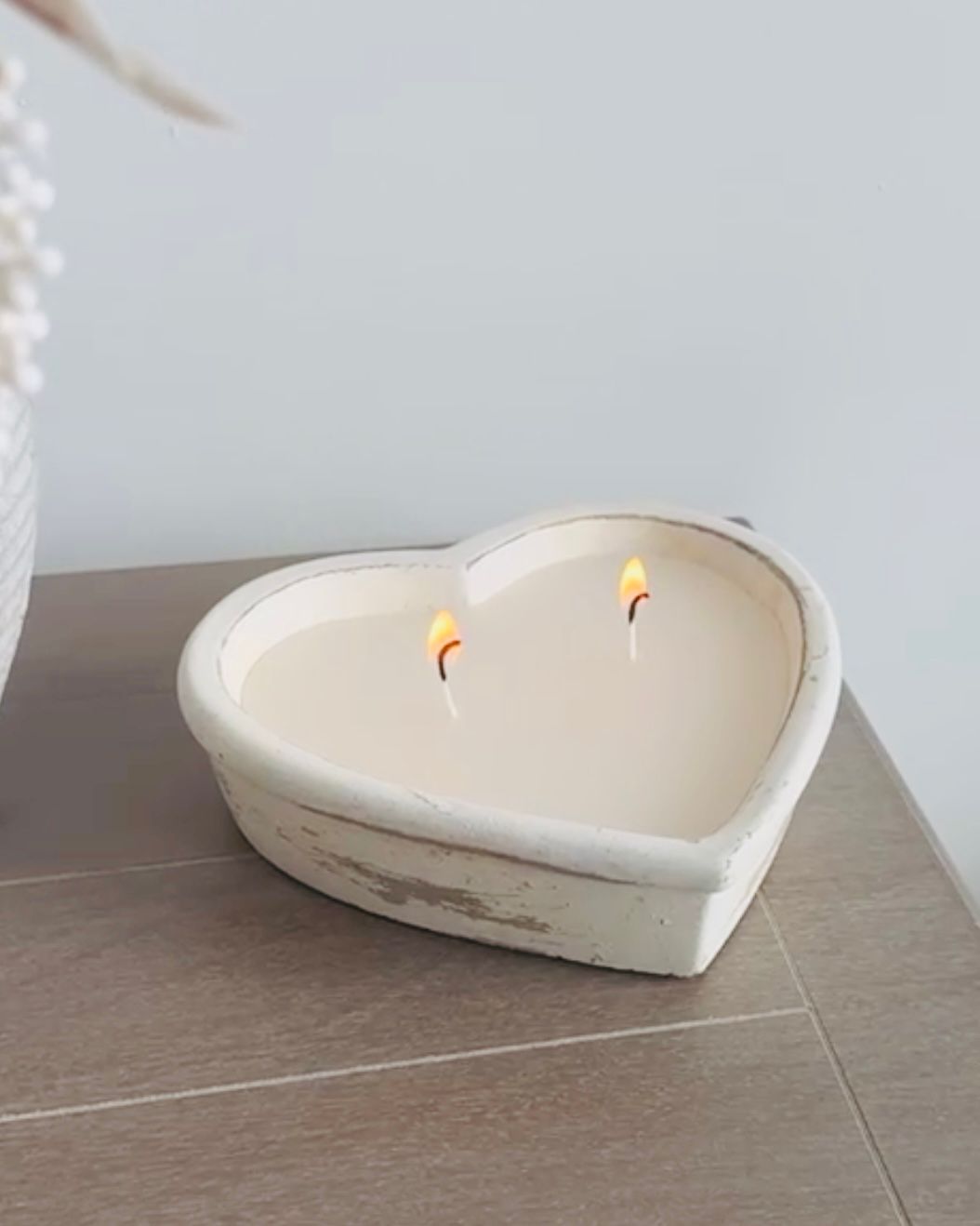 Rustic stone heart candle from Candlelight Products Ltd, showcasing a handcrafted stone heart candle with a warm, natural finish.
