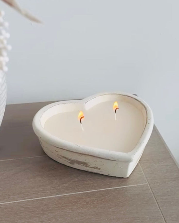 Rustic stone heart candle from Candlelight Products Ltd, showcasing a handcrafted stone heart candle with a warm, natural finish.