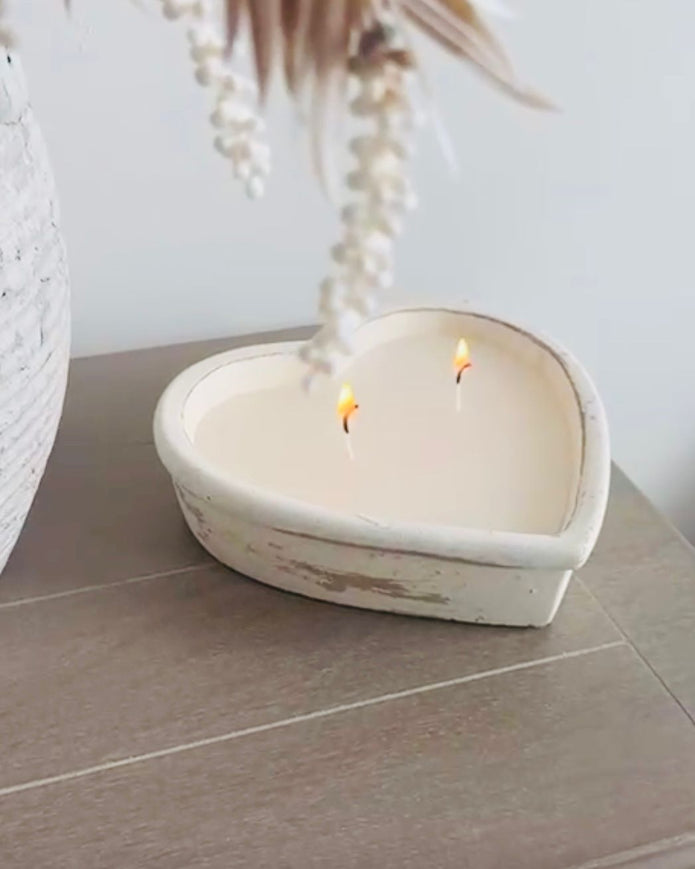 Rustic stone heart candle from Candlelight Products Ltd, showing a handcrafted candle with a stone heart shape and textured surface.