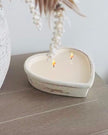 Rustic stone heart candle from Candlelight Products Ltd, showing a handcrafted candle with a stone heart shape and textured surface.