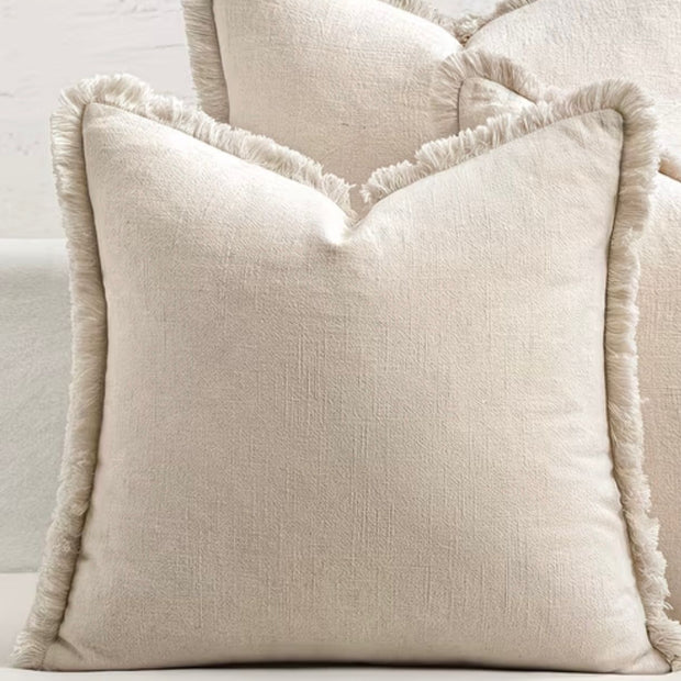 Neutral frayed edge cushion cover by Starlight Express, featuring soft furnishings with a relaxed, textured design.