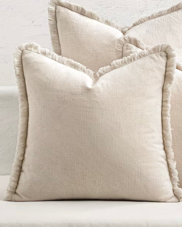 Neutral frayed edge cushion cover by Starlight Express, featuring soft furnishings with a relaxed, textured design.