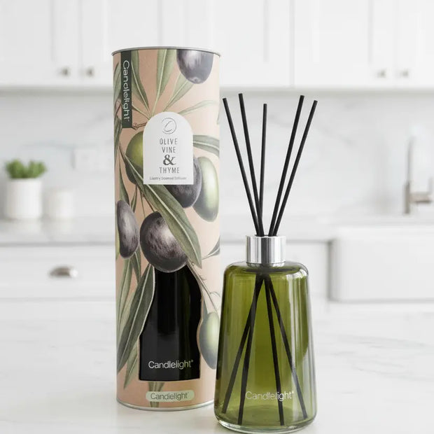 Reed diffuser with olive vine and thyme scent in a 300ml glass bottle, home fragrance from Candlelight Products Ltd.