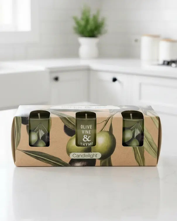 Set of 3 olive vine and thyme scented votive candles by Candlelight Products Ltd, with decorative candle holders.