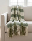 Olive green checked tassel cosy throw blanket by Gisela Graham, soft furnishings with tassel details on textured fabric.