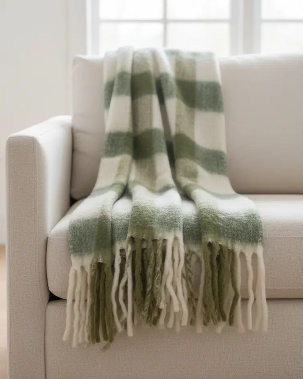 Olive green checked tassel cosy throw blanket by Gisela Graham, soft furnishings with tassel details on textured fabric.