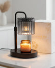 Black glass candle warmer lamp from Starlight Express with safe flameless lighting and timer feature, designed for ambient home use.