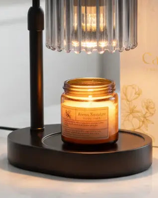 Black glass candle warmer lamp from Starlight Express with a safe flameless design and adjustable timer for ambient lighting.