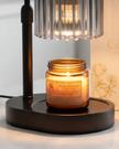 Black glass candle warmer lamp from Starlight Express with a safe flameless design and adjustable timer for ambient lighting.
