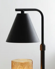 Black candle warmer lamp by Starlight Express, flameless lighting device with a sleek design and warm glow for safe home ambiance.