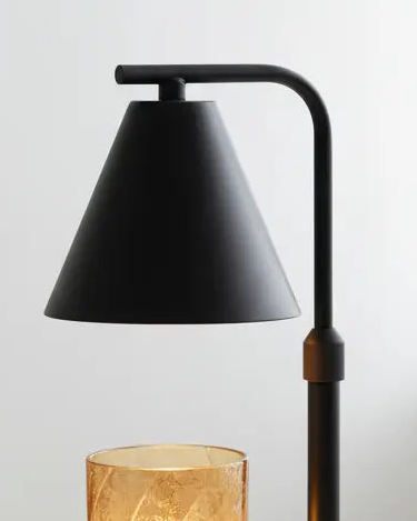 Black candle warmer lamp by Starlight Express, flameless lighting device with a sleek design and warm glow for safe home ambiance.