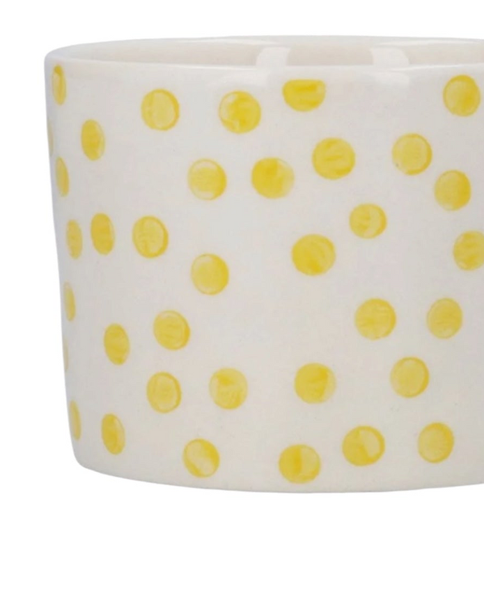 Yellow dotted stoneware mug by Gisela Graham, perfect for kitchen and dining use, featuring a vibrant, dotted design.