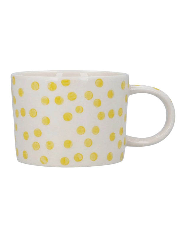 Yellow dotted stoneware mug from Gisela Graham, perfect for kitchen and dining use, with a vibrant, dotted design.