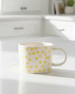 Gisela Graham yellow dotted stoneware mug for kitchen and dining, featuring a bright yellow dotted design with a smooth ceramic finish.