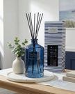 Blue striped Jeff Banks reed diffuser from Candlelight Products Ltd, 1000ml, with glass container and reed sticks for fragrance.