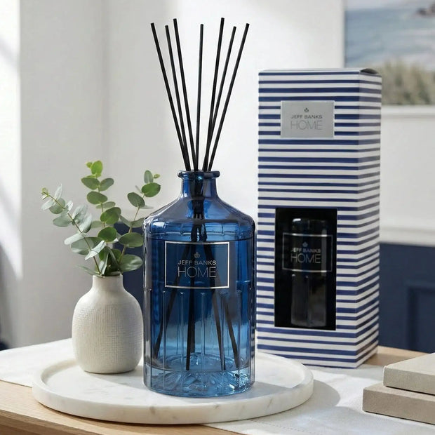 Blue striped Jeff Banks reed diffuser from Candlelight Products Ltd, 1000ml, with glass container and reed sticks for fragrance.