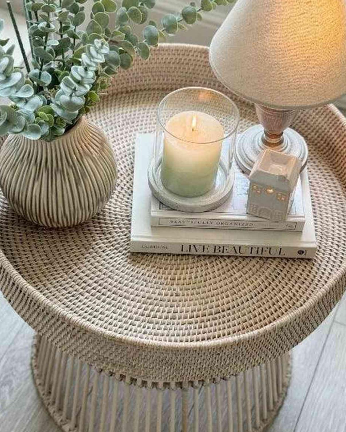 Lows rattan round side table with a woven surface and sturdy legs, perfect for living room or bedroom decor.