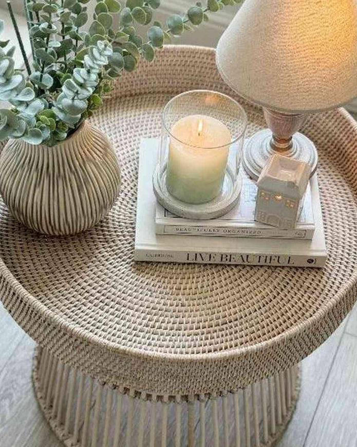 Lows rattan round side table with a woven surface and sturdy legs, perfect for living room or bedroom decor.