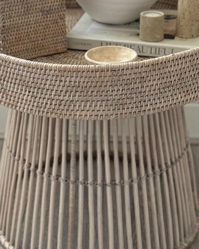 Lows rattan round side table with woven design, ideal for living room or bedroom decor, showcasing natural rattan material.
