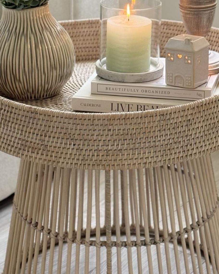 Lows rattan round side table with a woven surface, featuring a natural finish perfect for living room or bedroom decor.