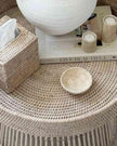 Lows rattan round side table with a natural woven design, perfect for living room or bedroom decor.