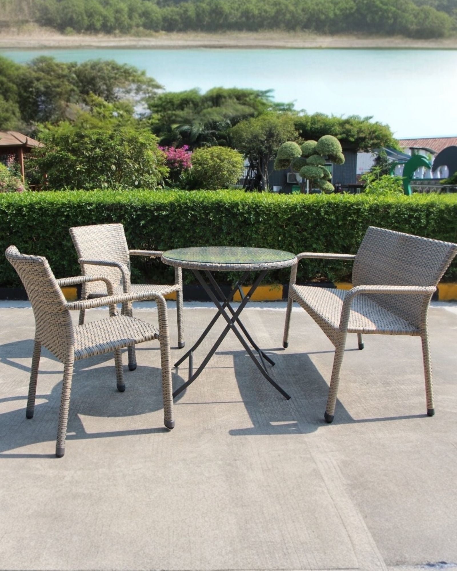 Rattan bistro garden furniture set with sofa chair and table by Pacific Lifestyle Ltd, outdoor patio furniture for garden or balcony.