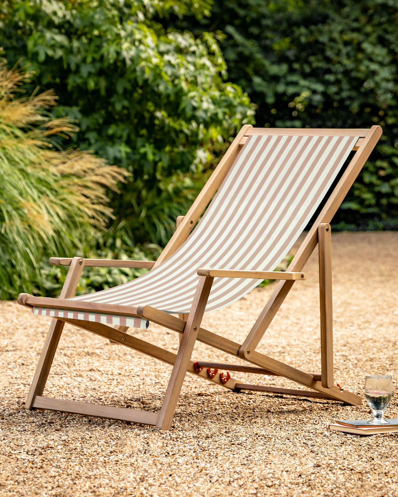 Creta wooden striped beige garden chair by Gallery Direct, showcasing its woven wooden design and comfortable outdoor seating