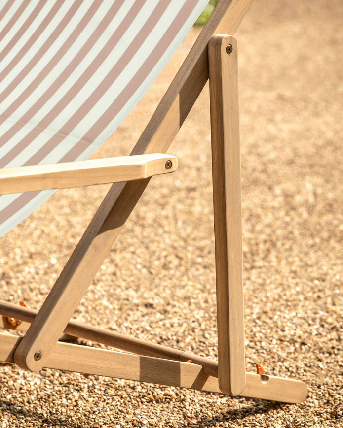 Beige Creta wooden stripped garden chair by Gallery Direct, featuring a stylish outdoor furniture design with slatted wooden seat and back.