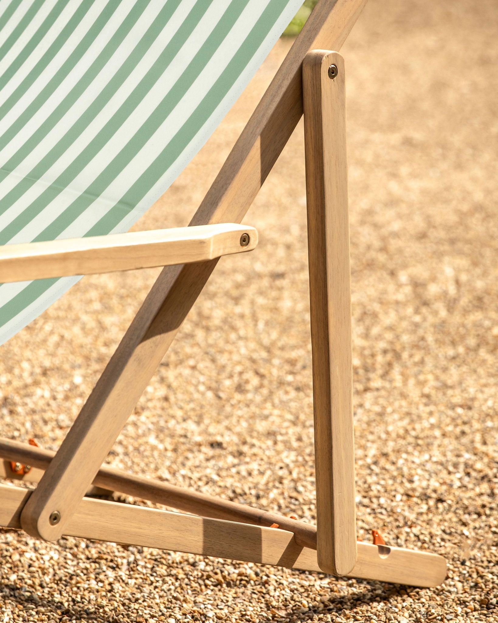 Sage green Creta wooden stripped garden chair by Gallery Direct, featuring a stylish outdoor seating design.